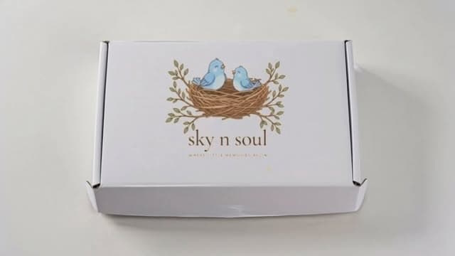 Sky n Soul gift box with the nest logo on the lid