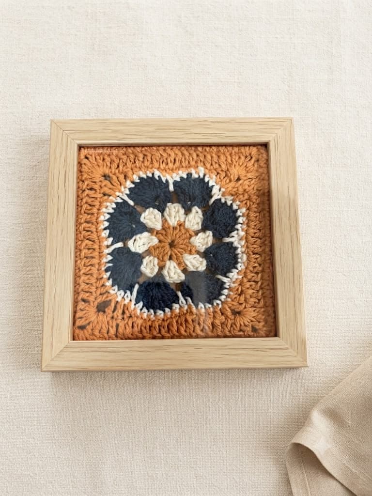 Navy garden on orange, light frame