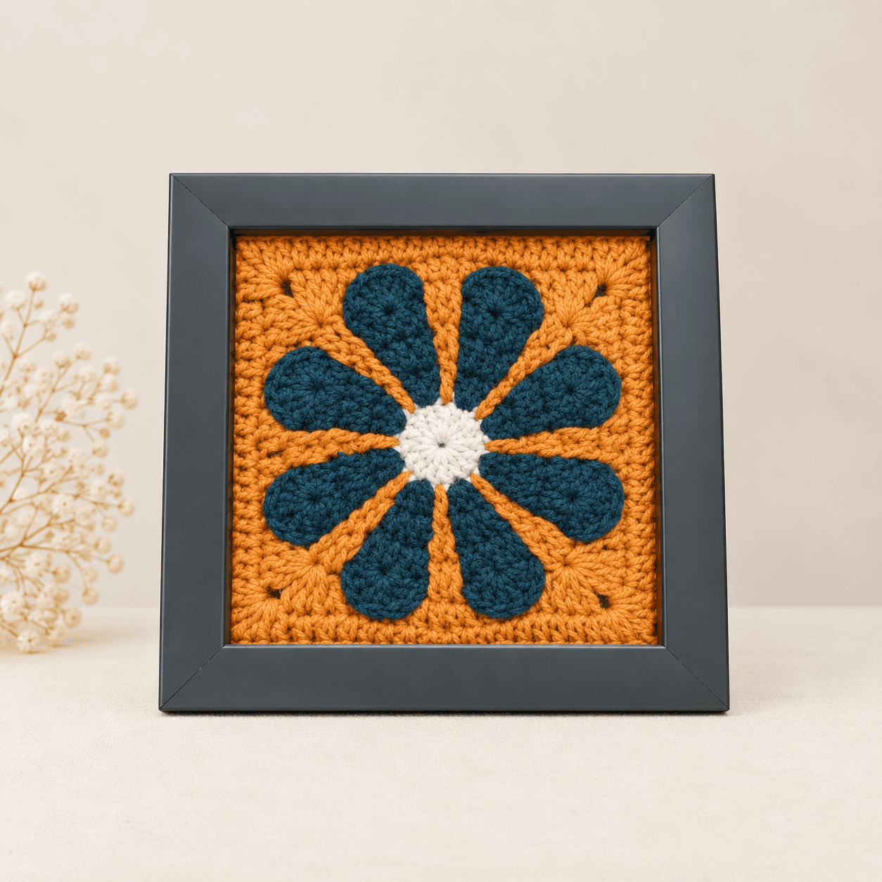 Teal daisy on orange, dark frame