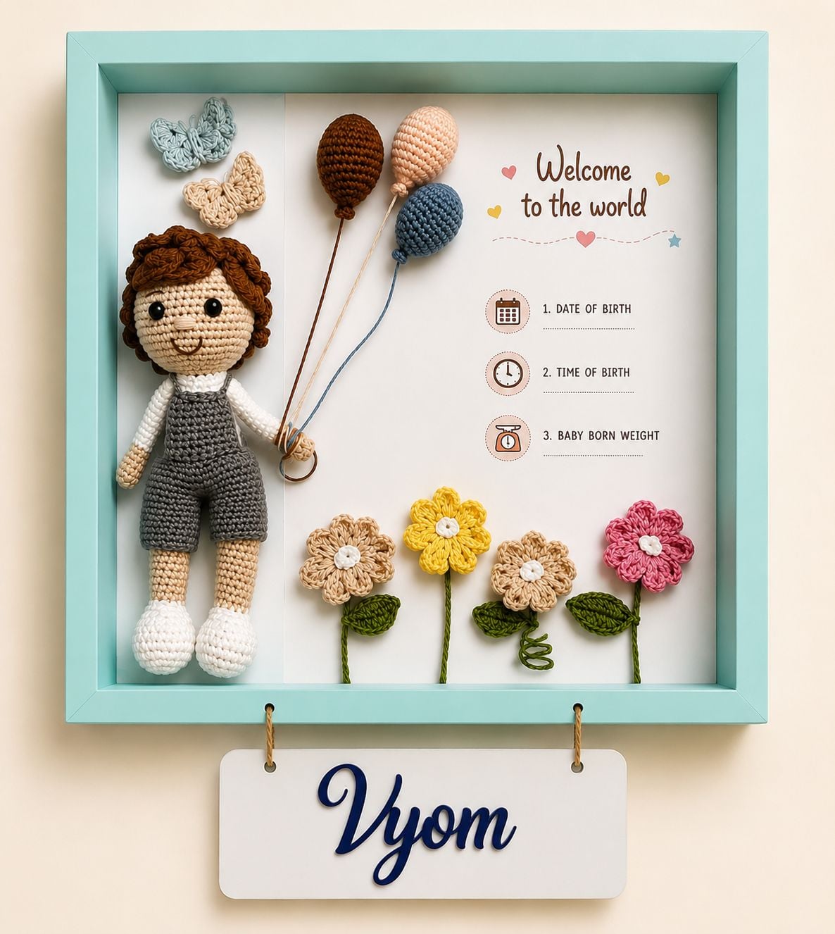 Memory Nest personalized birth announcement frame with crochet baby doll and balloons